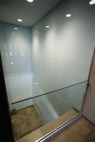 G391 Glass Rail Overlooking Painted Glass Stairwell.jpg